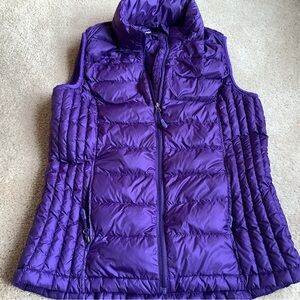 Down filled ( 90%) purple vest.  S  Heat Keep